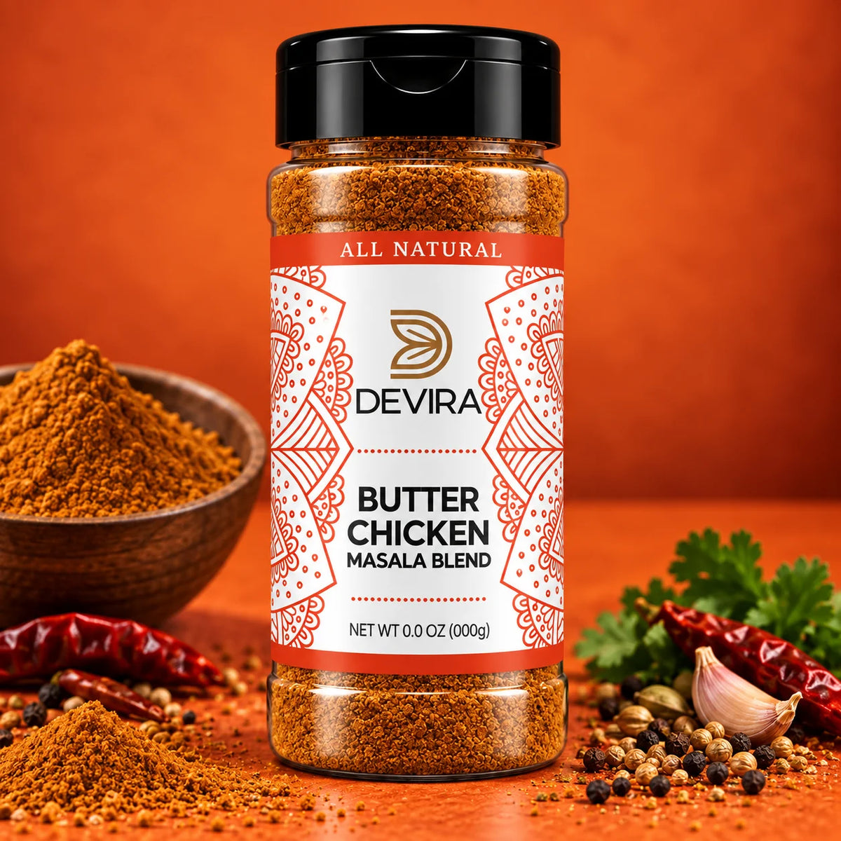 A bottle of Devira Butter Chicken Masala Blend spice mix centered on a warm orange surface, surrounded by whole spices, red chilies, garlic, and parsley, with a small bowl of loose spice mix in the background.