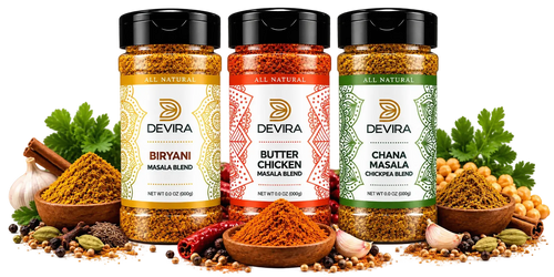 Three Devira brand masala spice jars displayed side by side on a white background, surrounded by their respective spices in wooden bowls and whole spices on a marble surface. The left jar is Biryani Masala Blend, the middle is Butter Chicken Masala Blend, and the right is Chana Masala Chikooza Blend.