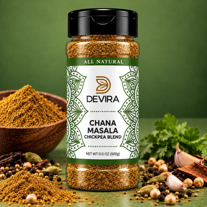 A bottle of Devira Chana Masala Chickpea Blend spice blend centered on a green background, surrounded by loose spices, garlic, cilantro, and a wooden bowl of powder.